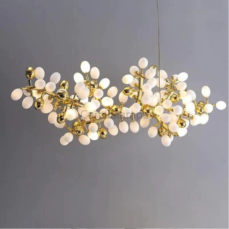 The collection of chandeliers is inspired by the growth dynamics of the vine plant grape. The frame of the branches is handmade and the cups are made of balls in the shape of grapes in milk white and gold. It is an elegant and charming lamp for banquets, living room foyers.